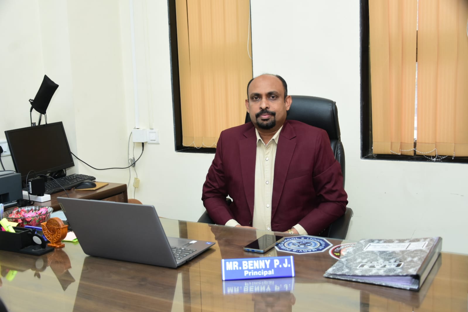 Mr. Benny P. J., Principal
